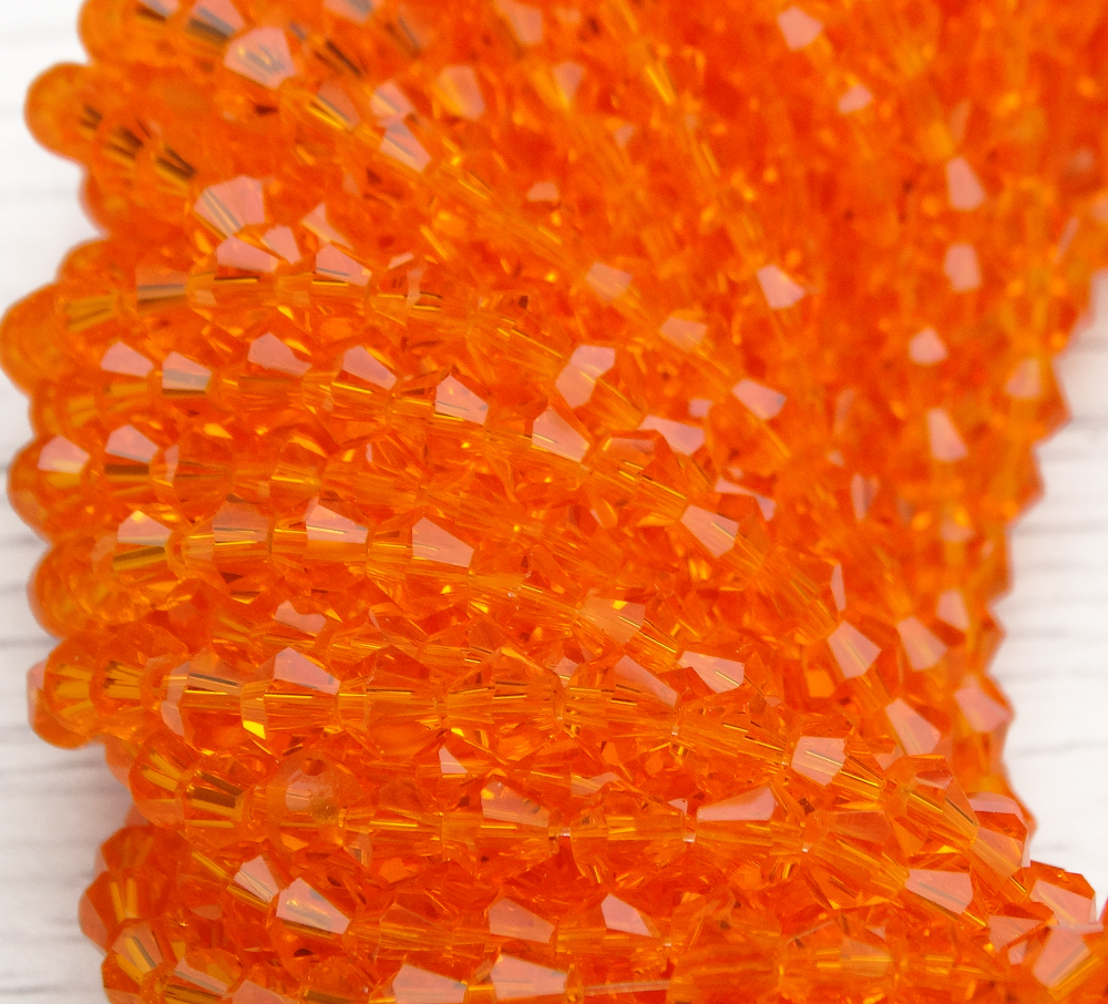 ББ007НН4 Хрустальные бусины "биконус", цвет: оранжевый прозрачный, размер 4 мм, кол-во: 95-100 шт.