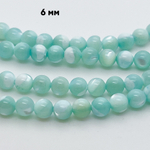 Перламутр тонированный, цвет голубой, диаметр 6,3 мм, цена за 31-32 шт (1/2 нити)