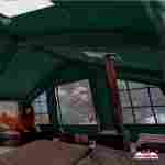 Пневмокаркасная всесезонная палатка «Тёплая Искра» 3,6×4,8×2,2 м — с печкой, из ПВХ, зелёная