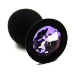 Анальная пробка из силикона с темно-фиолетовым стразом, M (Цвет: черный с фиолетовым)