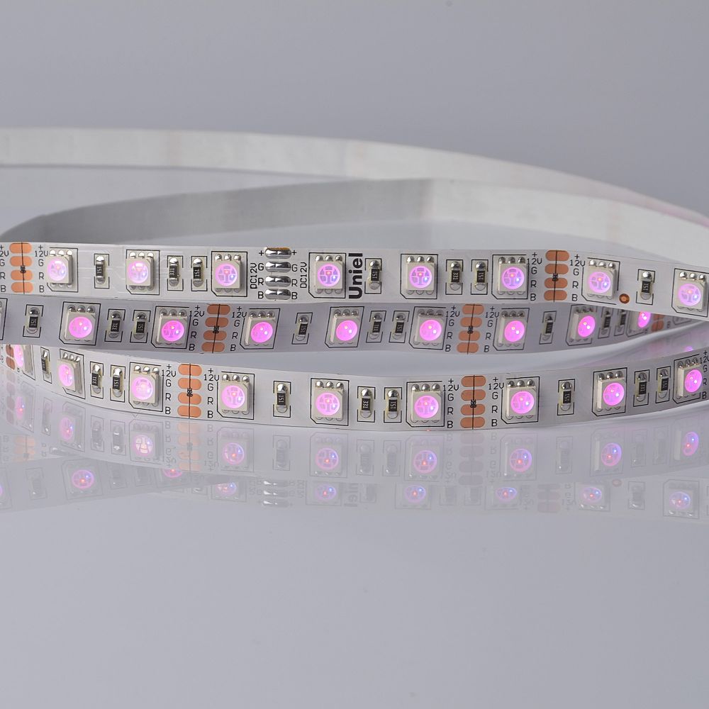 ULS-5050-60LED-m-10mm-IP20-DC24V-14.4W-m-5M-RGB Гибкая светодиодная лента UNIEL на самоклеящейся основе. Упаковка катушка 5 м. в герметичной упаковке. IP20. Угол излучения 120 . Мультиколор.