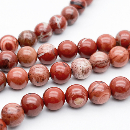 Яшма красная бусины, диаметр 8,5-8,7 мм, цена за 22-23 шт (1/2 нити)