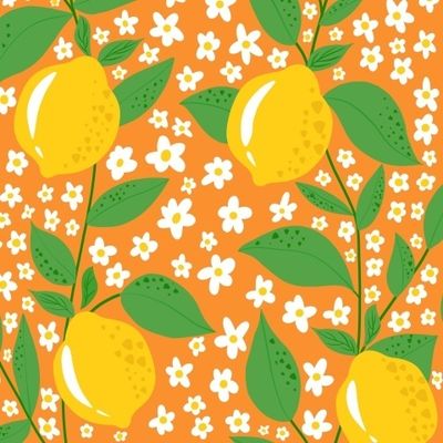 Лимоны и цветы на оранжевом фоне