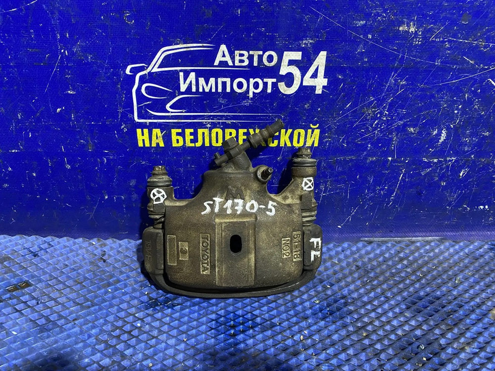 Суппорт тормозной передний левый TOYOTA CARINA 1991