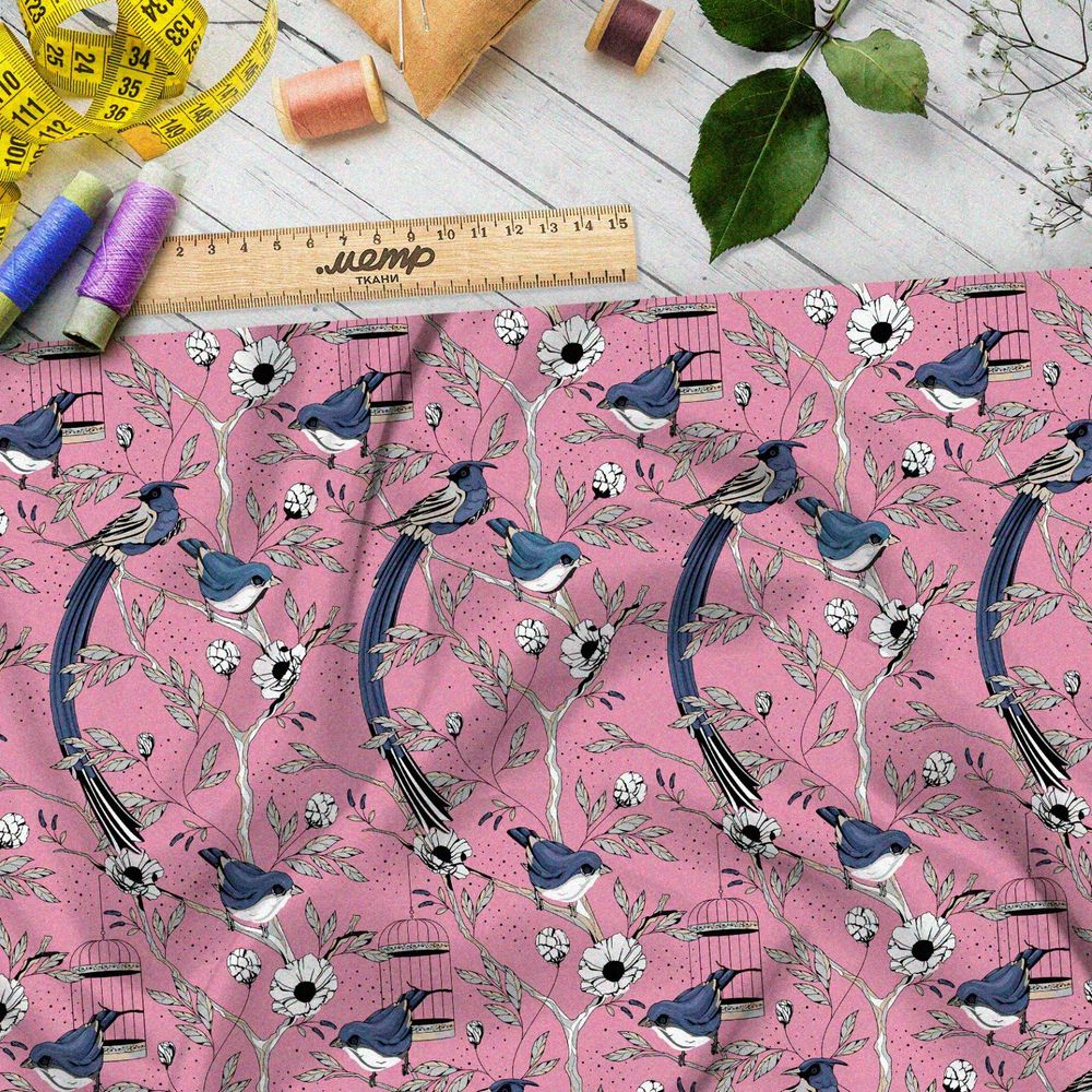 Ткань габардин мелкие снегири, цветы и птичьи клетки на розовом фоне