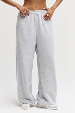 Широкие джоггеры без начеса с лампасом цвета серый меланж