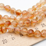 "Цитрин" бусины (кварц), диаметр около 7,5-7,8 мм, цена за 12 шт (1/4 нити)