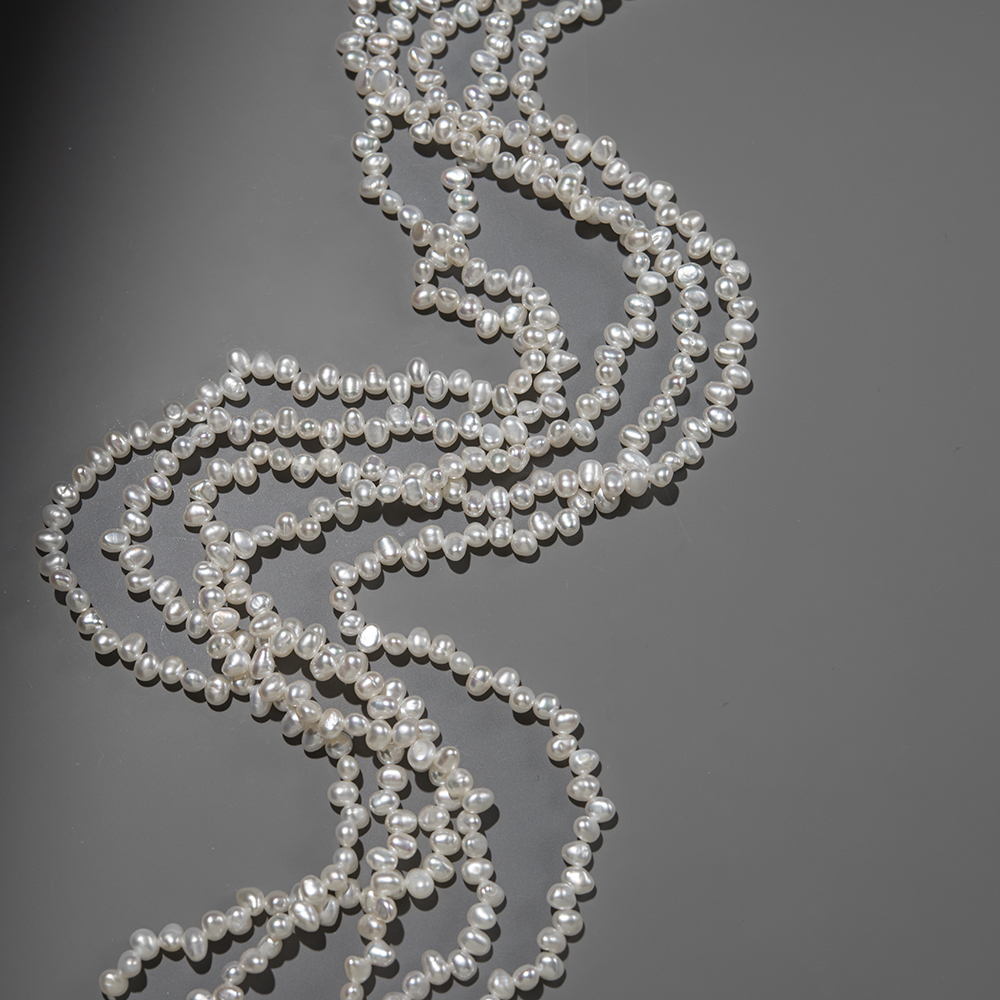 Жемчуг культивированный овальный со смещенным отверстием, белый, 5*3,5мм