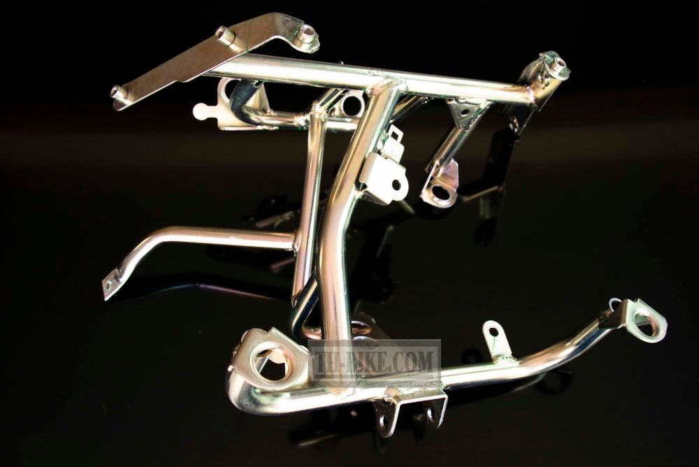 50310-KWN-930 (50310-KWN-640). STAY, FR. COVER. Headlight Stay. Honda PCX125 1 gen.