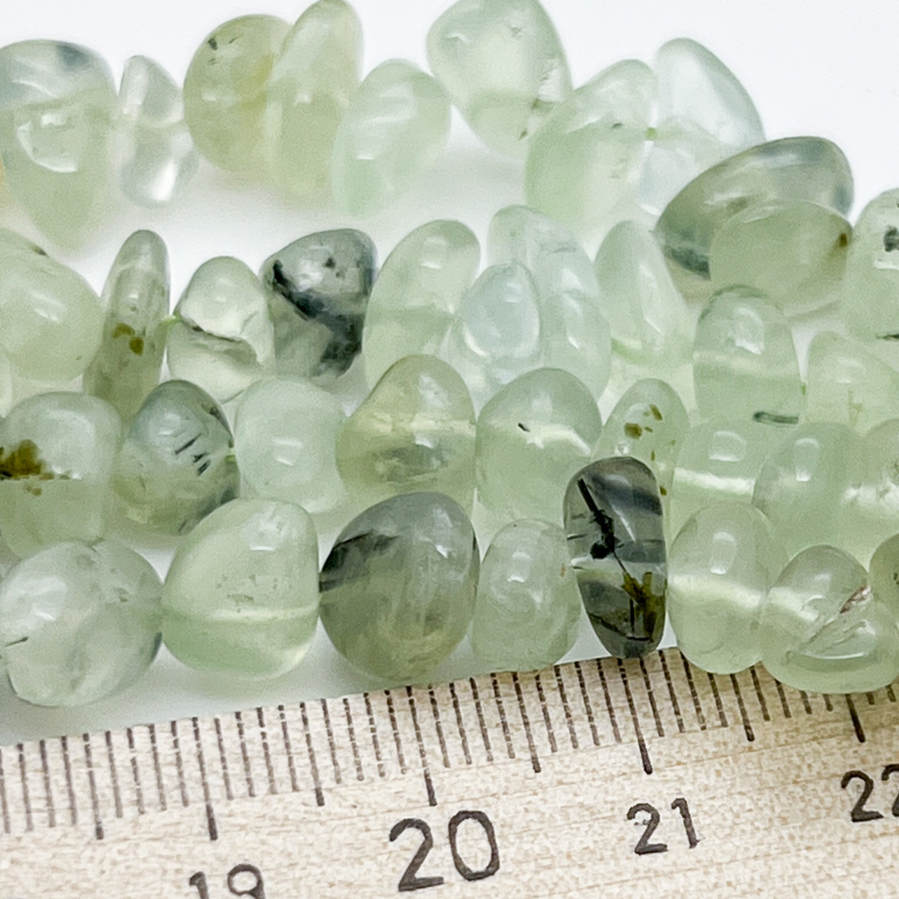 Пренит бусины, галтовка, размер около 10-12*4-6 мм, цена за 19 см (1/2 нити)