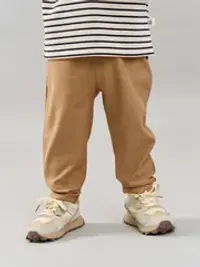 Брюки из джинскота "Песок" с отворотами 0+