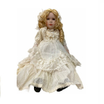 Кукла в бежевом платье