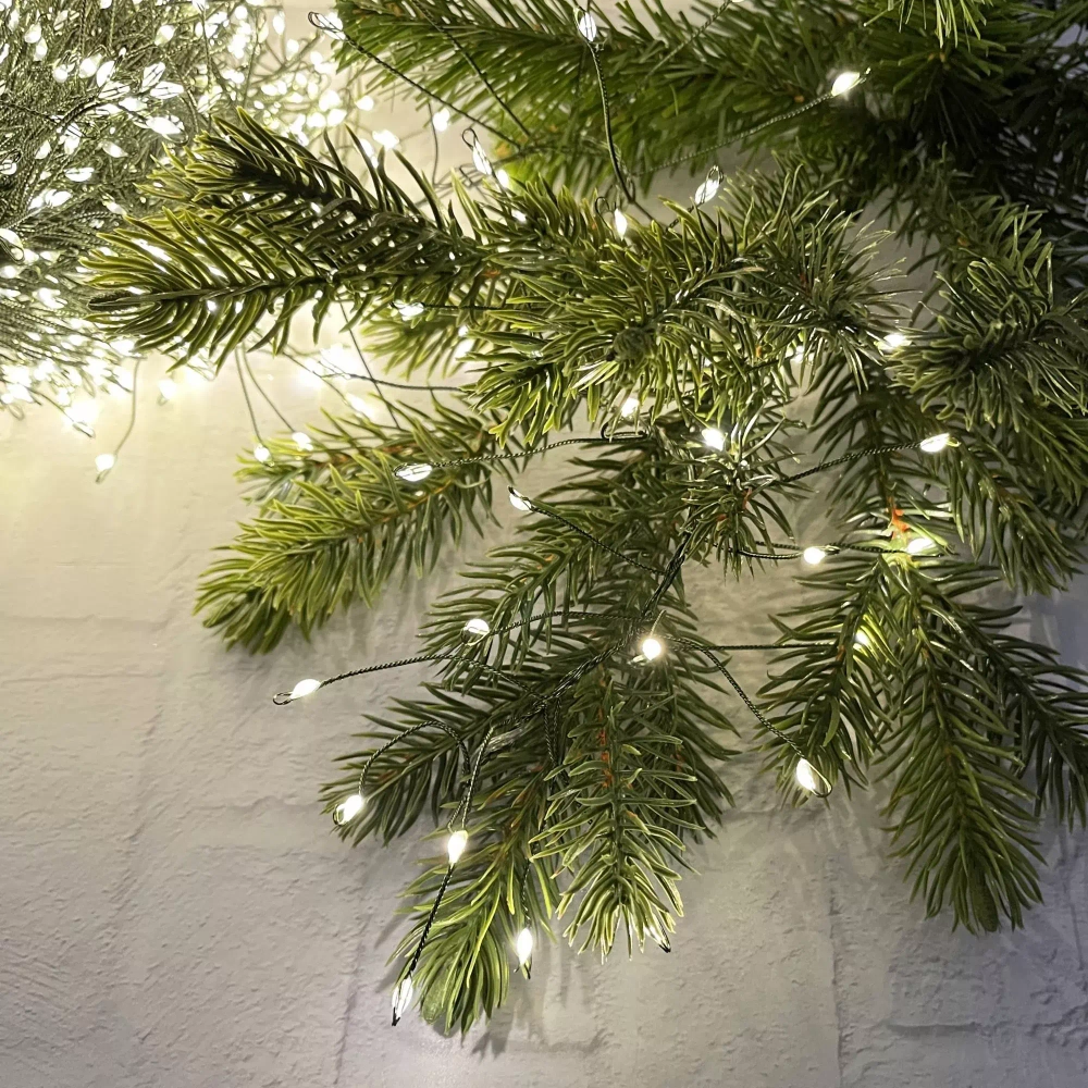 Светодиодная нить кластер 960 теплых белых ламп, 6 м., 8 режимов, зеленый провод, Christmas DeLuxe (87448)