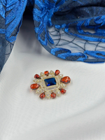 Брошь в винтажном стиле с синим кристаллом и терракотовыми вставками из ювелирной смолы, золото