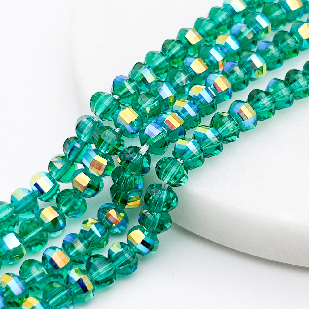 Бусины стекло, цвет изумрудный АВ, размер 4,5*6 мм, цена за отрезок 19 см (1/2 нити)
