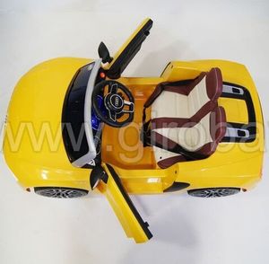 Детский электромобиль River Toys AUDI R8 желтый