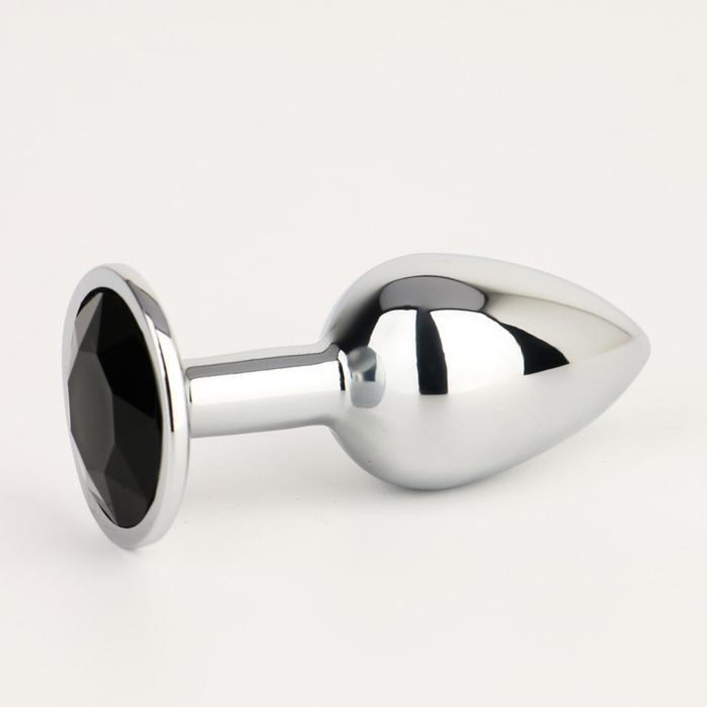 Серебристая анальная втулочка с черным кристаллом - 7 см. (Цвет: серебристый)