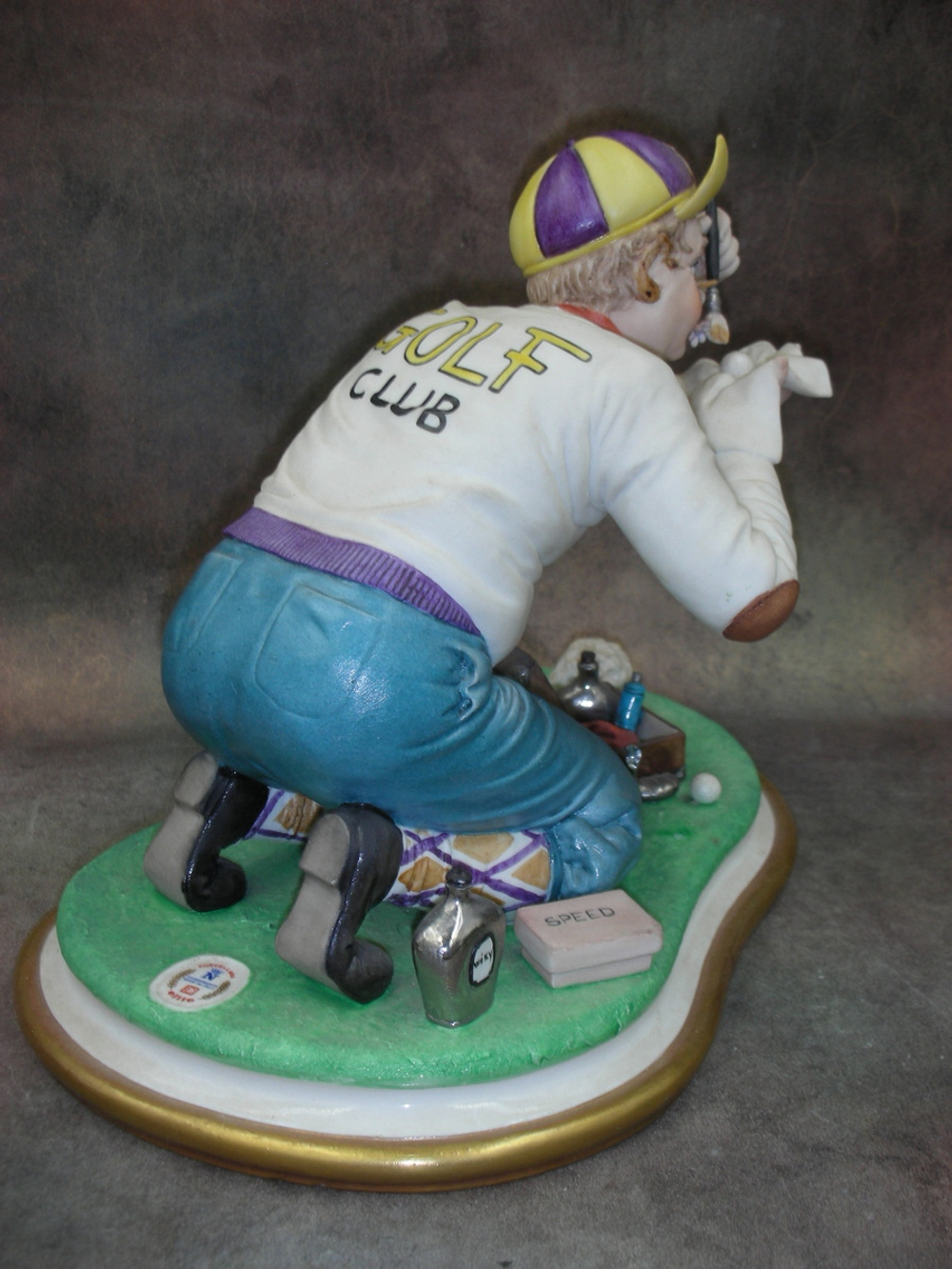 Статуэтка. Фарфор. Гольф клуб. Capodimonte. Италия