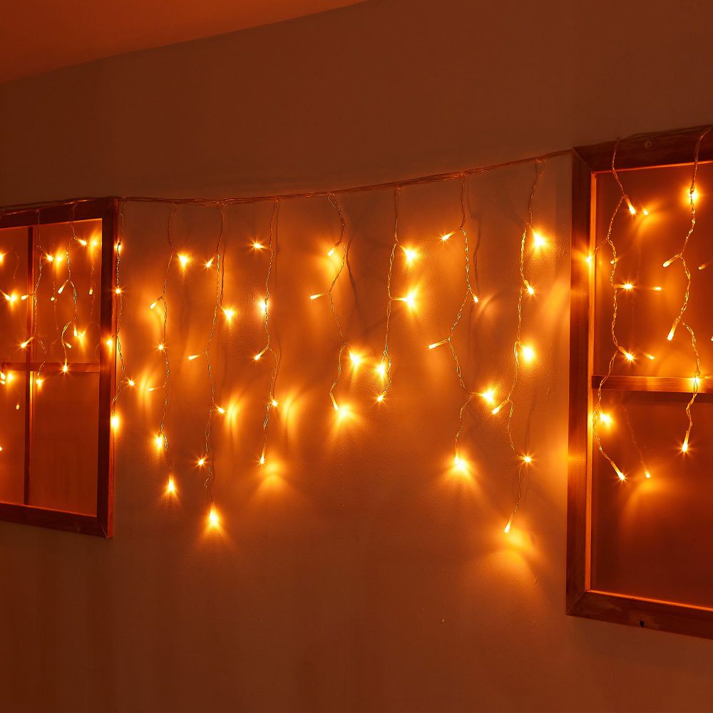 ULD-B12006-195-TTK AMBER IP44 Бахрома светодиодная с эффектом мерцания. 12м. Соединяемая. 195 светодиодов. Янтарный свет. Провод прозрачный. ТМ Uniel