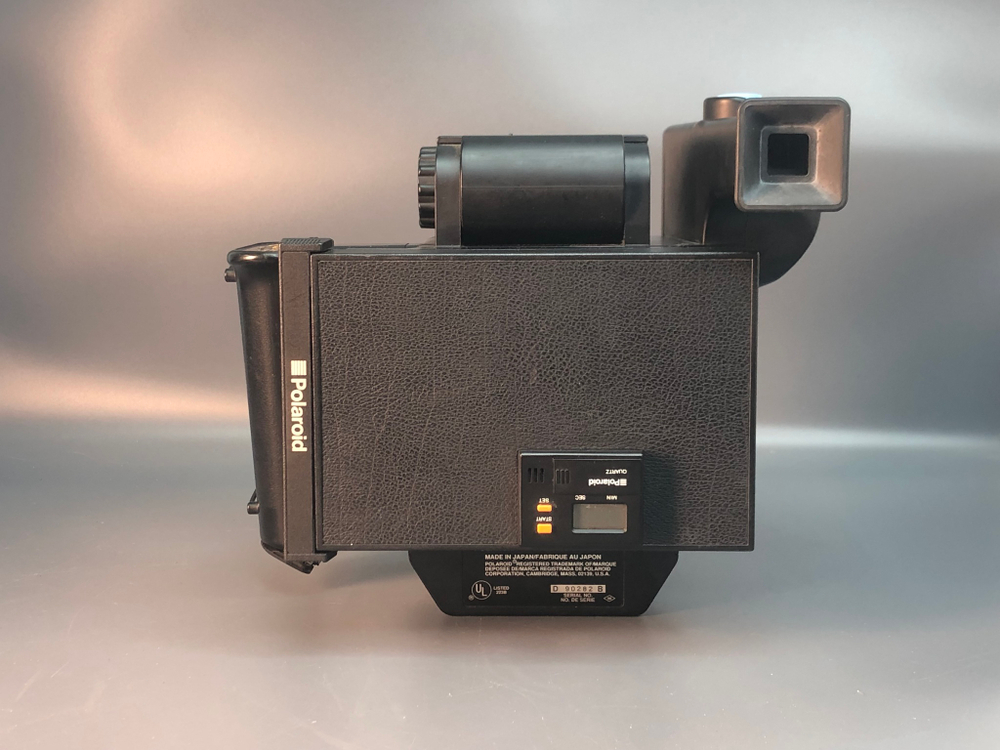 Polaroid Miniportrait 203, обломана крышка батарейного отсека