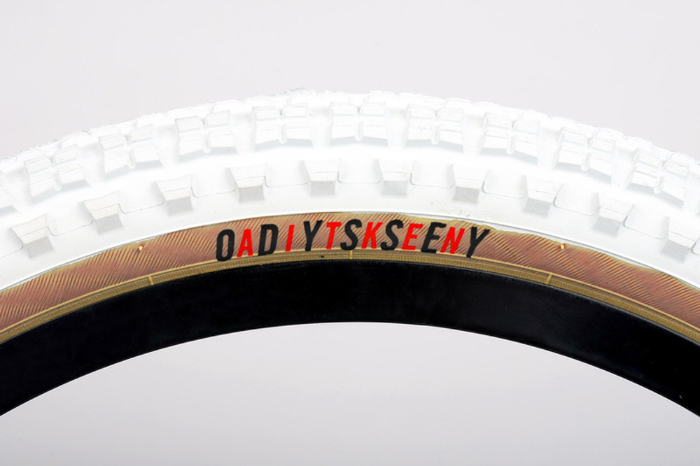 Покрышка Odyssey Mike Aitken Knobby сталь (2.35" 90 psi (белый / бежевая боковина)
