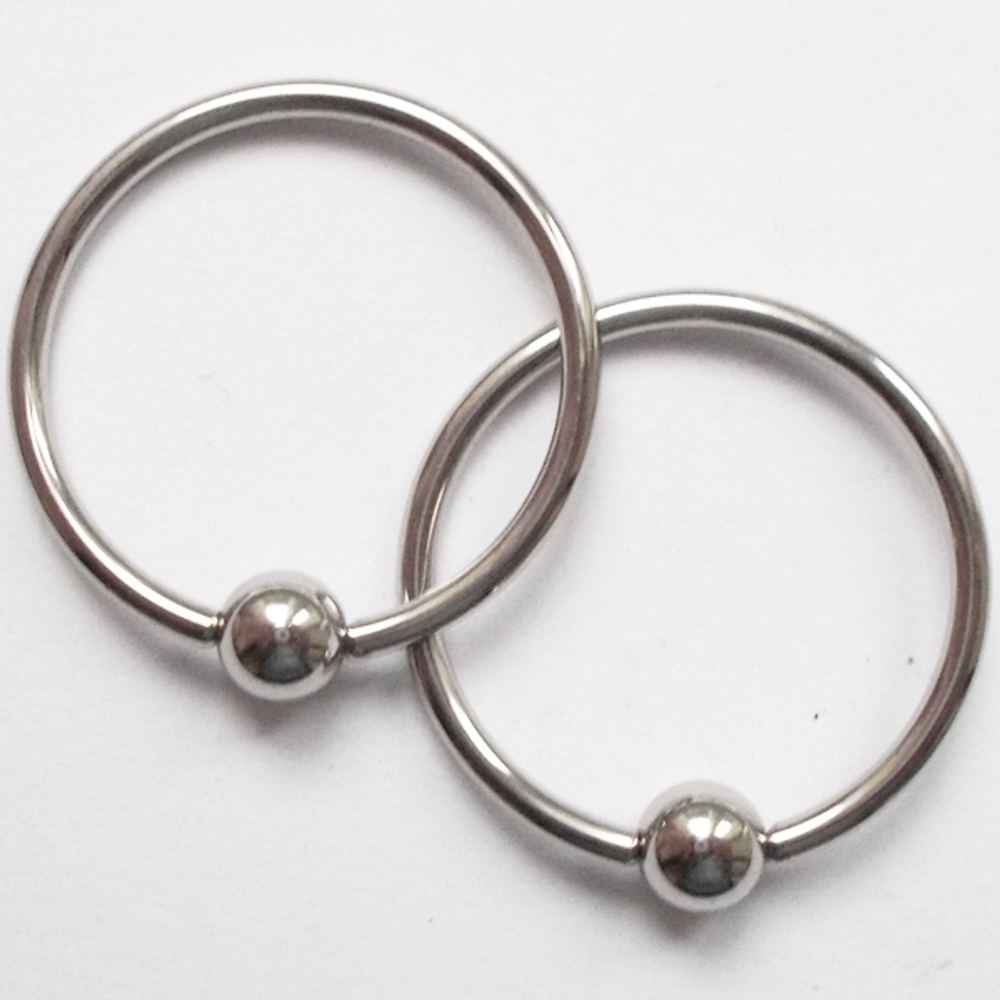 Кольцо сегментное, диаметр 16 мм для пирсинга. Толщина 1,2 мм, шарик 4 мм.Медицинская сталь. 1 шт