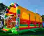 Коммерческий надувной батут «Страна Сафария 2» с крышей и двумя горками, 12*6*6 м