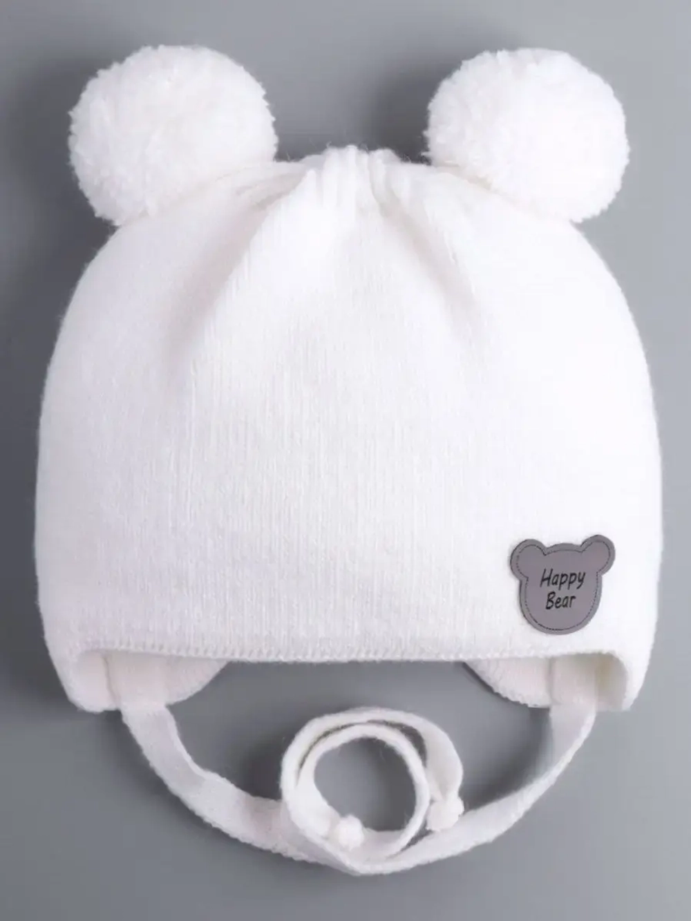 Шапка детская осенняя с завязками и помпонами