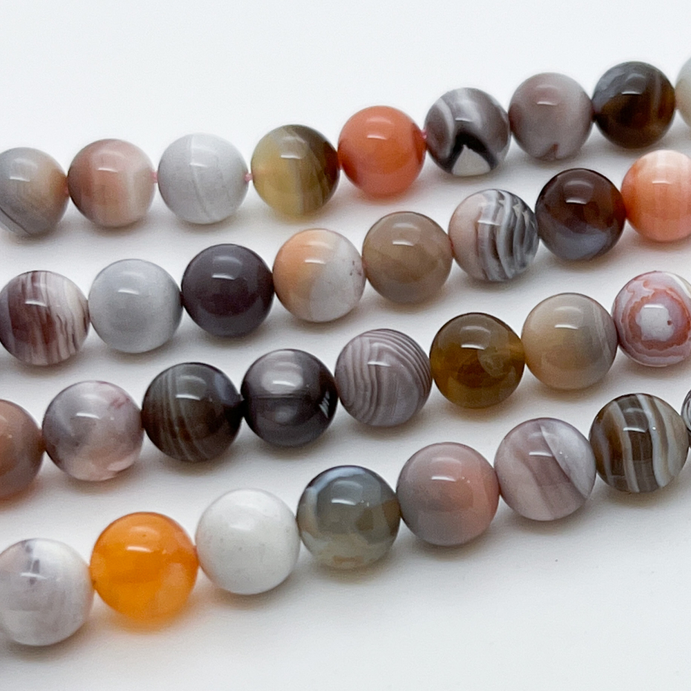Агат Ботсвана, розовый тон, диаметр 7,9-8,1 мм, цена за 22-23 шт (1/2 нити)
