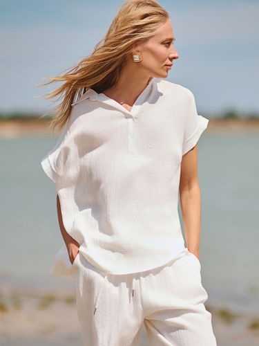 Белый льняной костюм с брюками