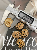 Пуговицы теплое золото Скиапар.черной эмалью в форме ракушки