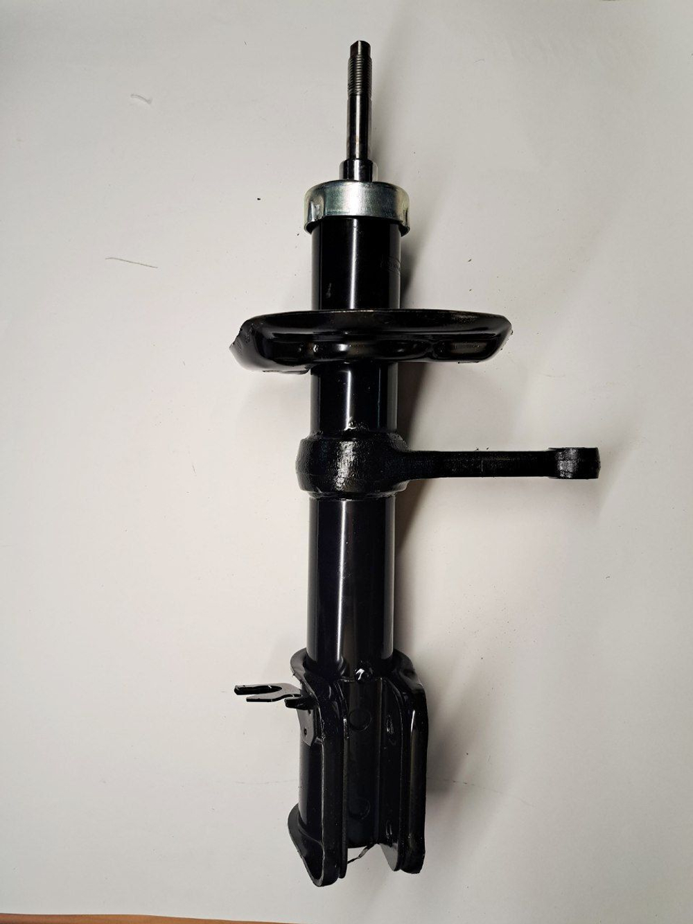 Стойка амортизатора передняя правая 1119-2905402 Птимаш