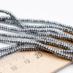 Гематит Рондель граненый бусины (имитация), цвет серебристый, размер около 1,5*2 мм, цена за отрезок 19 см (1/2 нити)