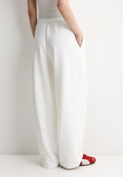 Брюки спортивные женские PUMA ESS GRAPHIC LEO LUXE Bedazzled Slouchy Pants TR