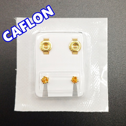 Серьги-гвоздики для прокола ушей под пистолет. CAFLON (Англия). Золотистые с желтыми кристаллами, крапление