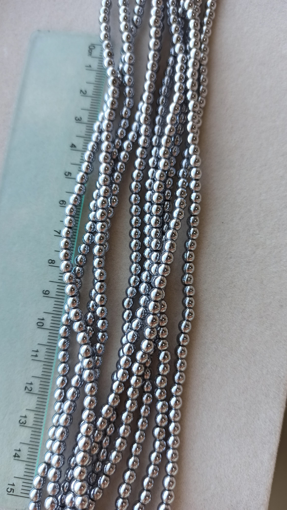 Гшг438-с Гематит шар гладкий 4мм, серебро, нить 38см