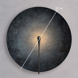 Настенный светильник с эффектом мягкого свечения, создающим ощущение глубины и уюта.