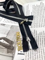 Молния на черной атласной тесьме серебристая