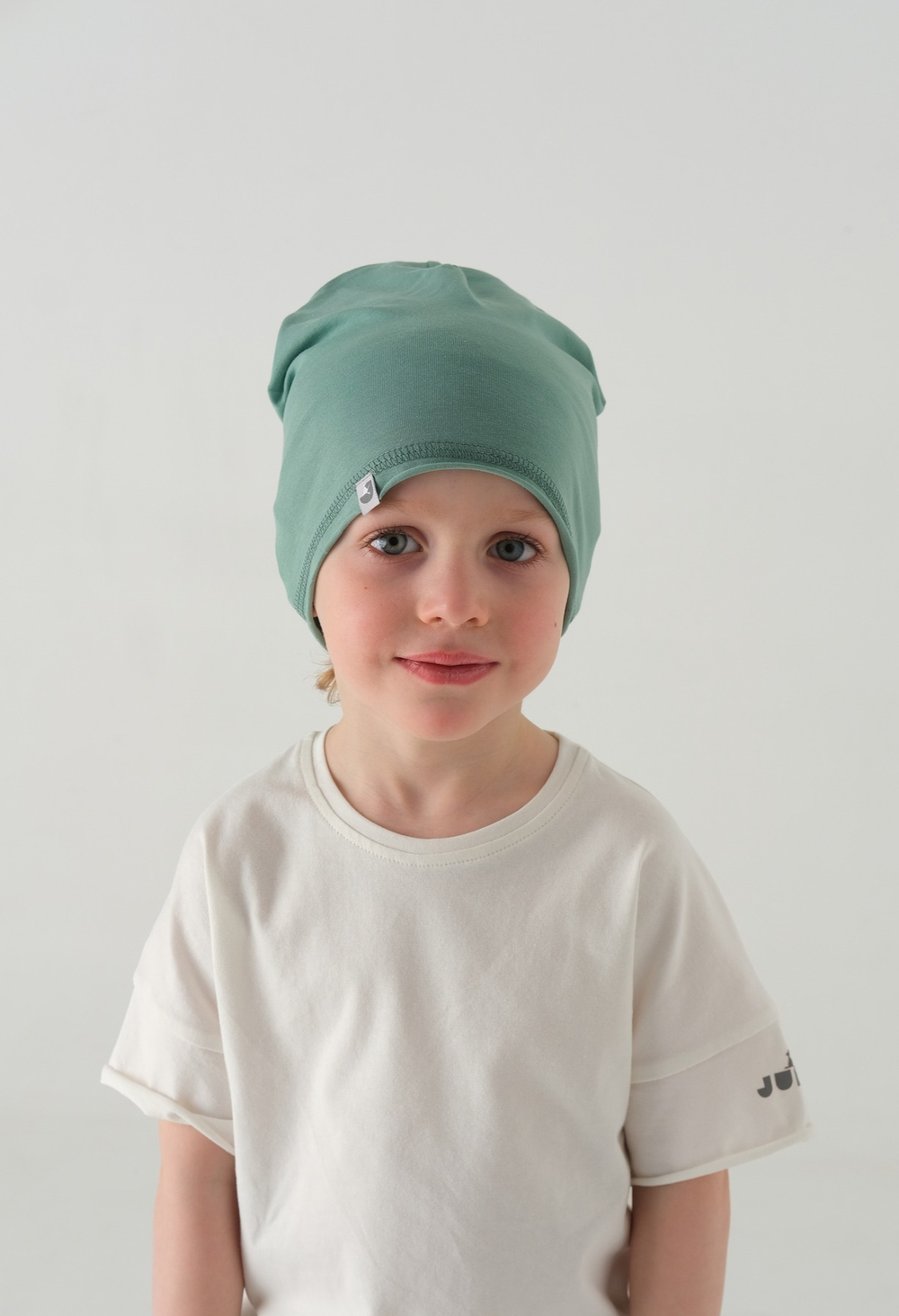 Шапка трикотажная однослойная (Св.изумруд) ЛАЙТ