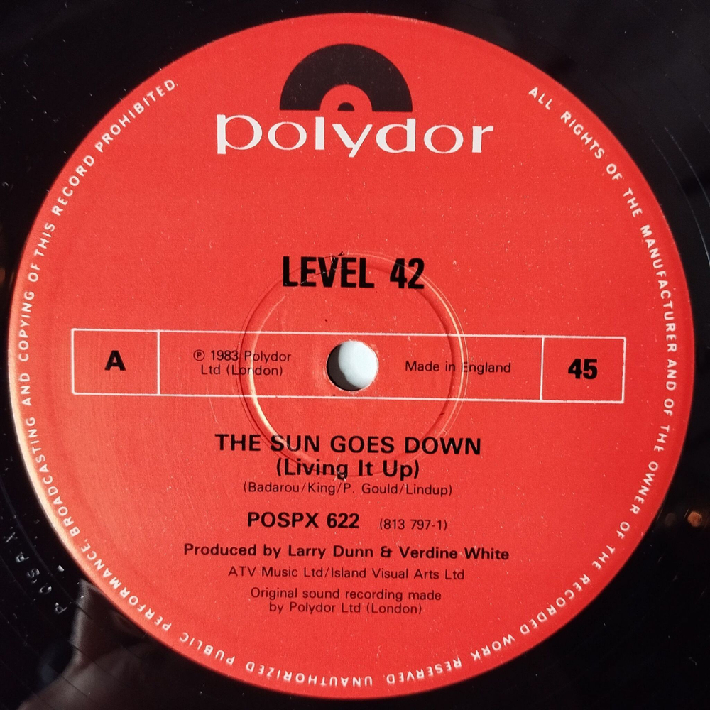 Винтажная виниловая пластинка LP Level 42 The Sun Goes Down (Living It Up) (UK 1983) 45 RPM Maxi Single