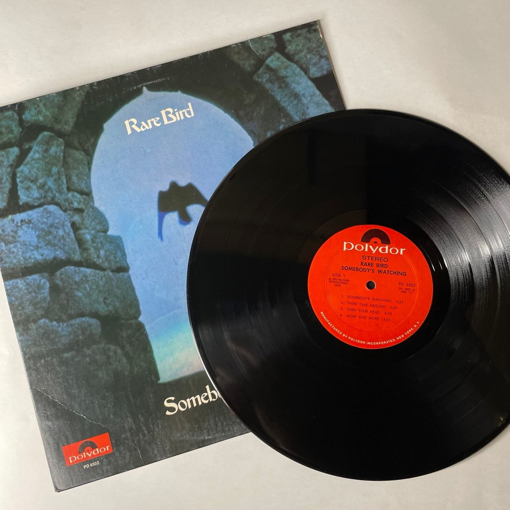 Винтажная виниловая пластинка LP Rare Bird Somebody's Watching (США 1973)