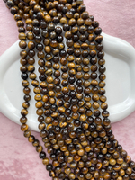 Нить бусин тигрового глаза 10,5мм