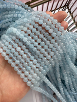 Нить бусин из тонированного кварца 6,5мм, гладкие