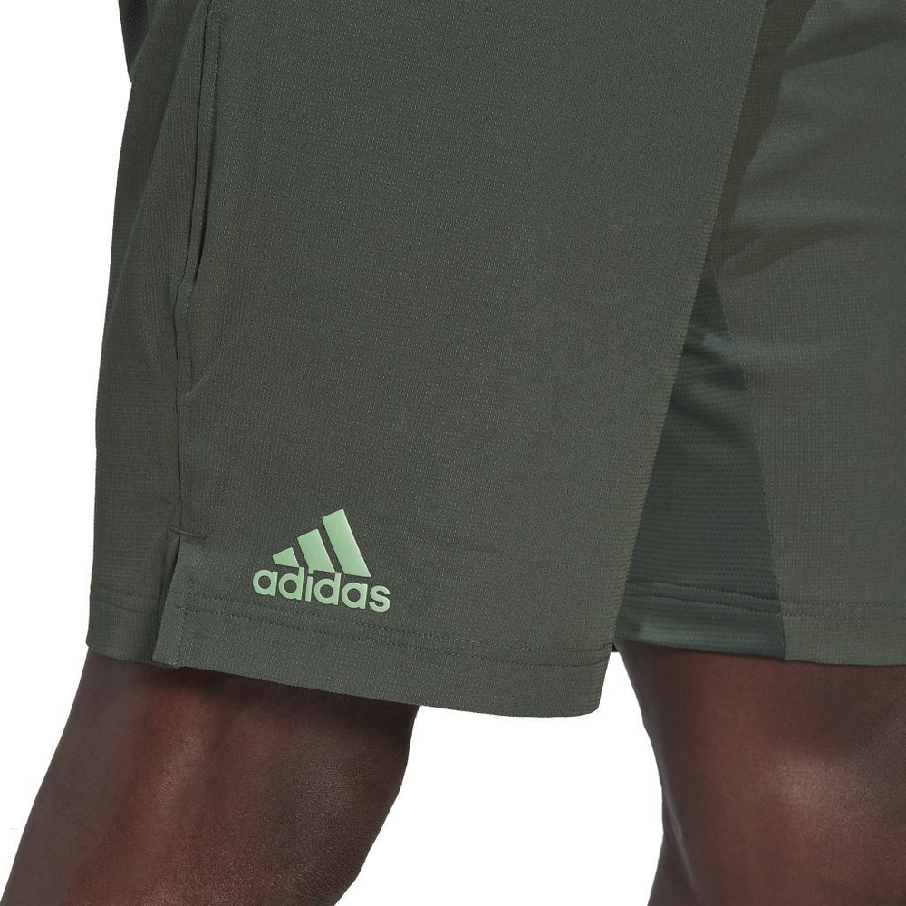 Мужские теннисные шорты Adidas Ergo Tennis Shorts 9" M - green oxide
