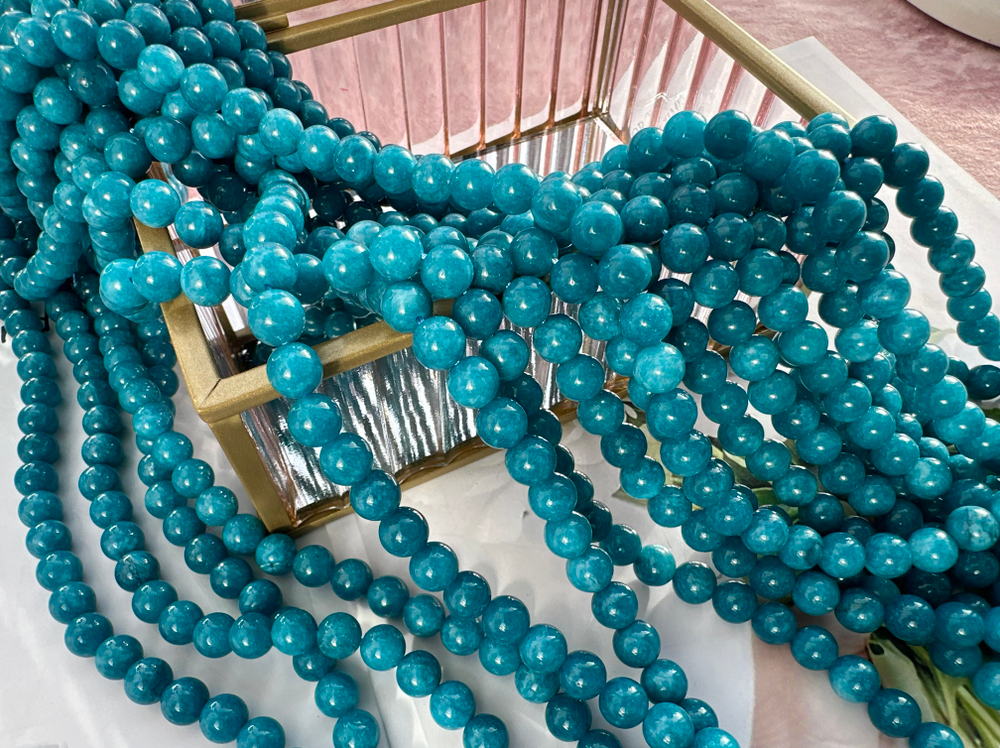 Нить бусин из тонированного кварца 8,4мм, гладкие