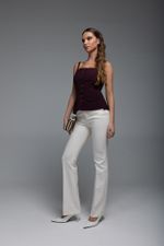 Брюки расклешенные от колена (в оттенке айвори)