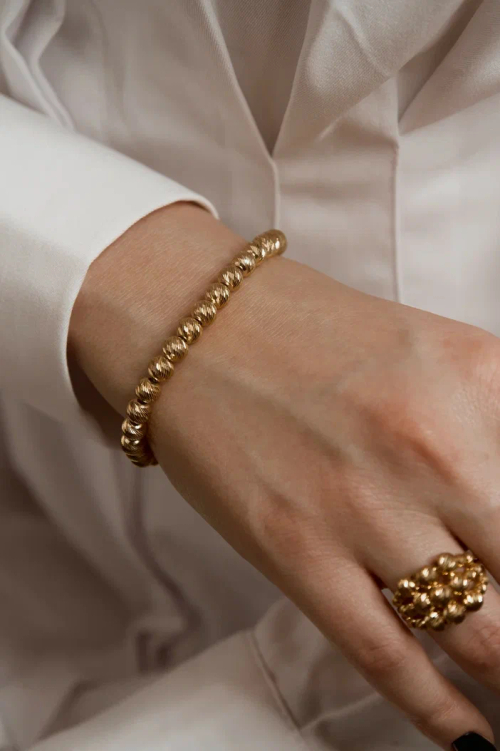 Браслет с шарами и алмазными гранями в золочении