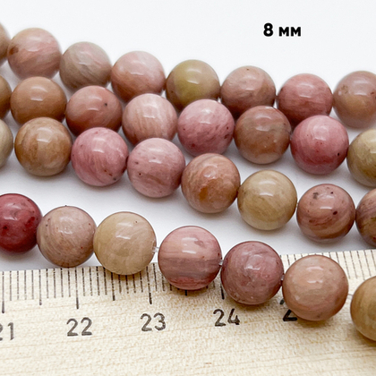 «Родонит» (мусковит с альбитом и кварцем, тонированный), диаметр 7,8-8,1 мм, цена за 23-24 шт (1/2 нити)