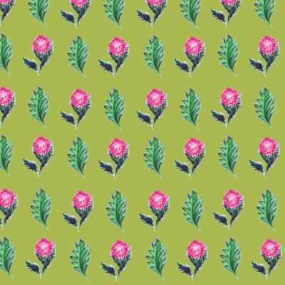 Чертополох на зеленом фоне