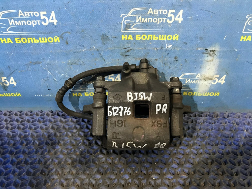 Суппорт тормозной передний правый MAZDA FAMILIA 1998-2003